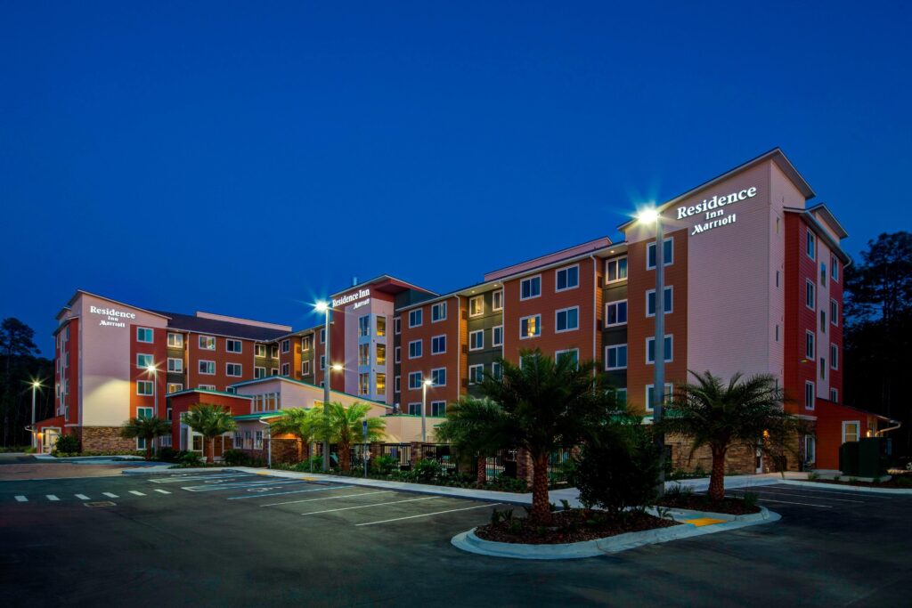 Exterior of Residence Inn Jacksonville South/Bartram Park, showcasing modern design and welcoming entrance.