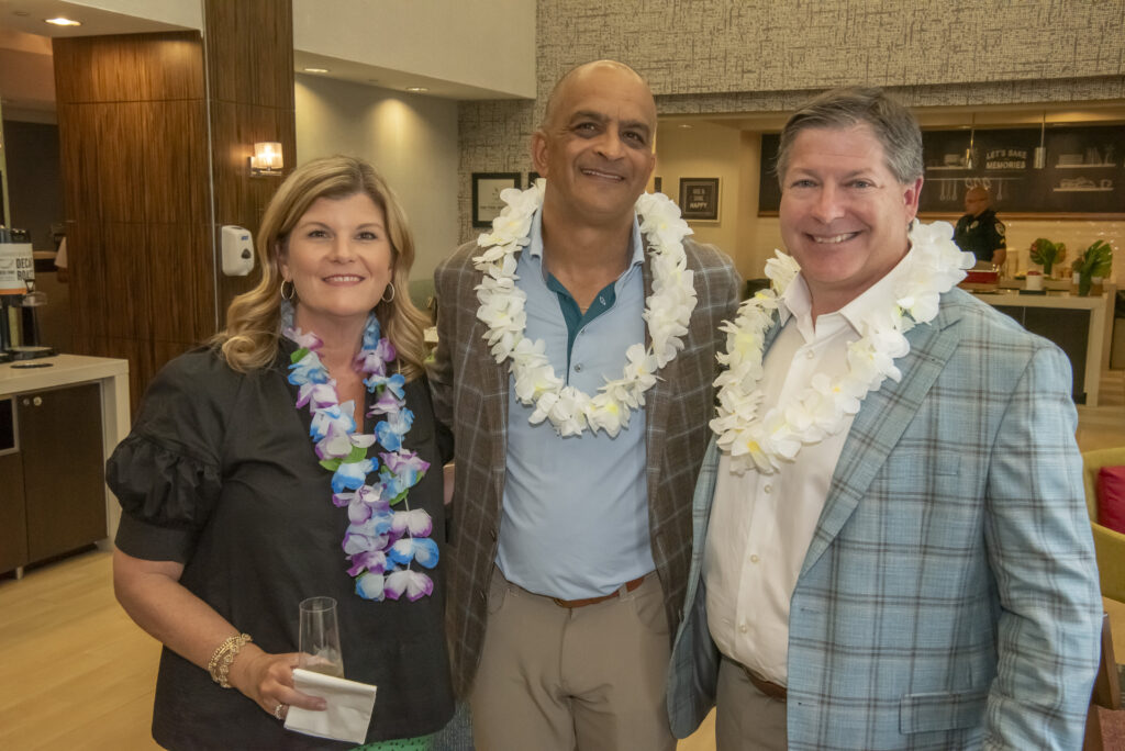 LBA COO Farrah Adams, President Beau Benton, and Hiren Desai of 3H Hotel Group at the ribbon cutting event for the Hampton Inn Altamonte Springs renovation.