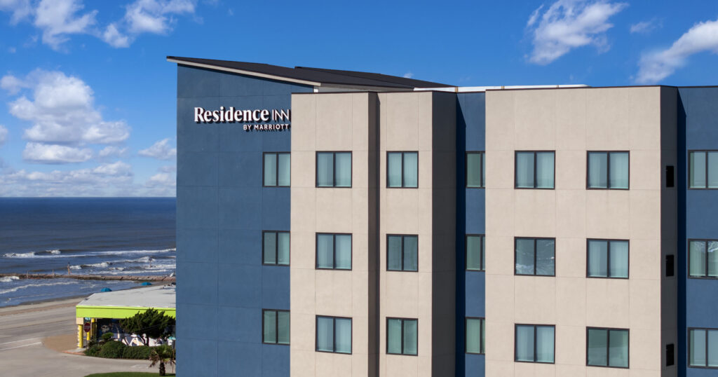 Serene view of Residence Inn Galveston Island with the Gulf waters in the background.