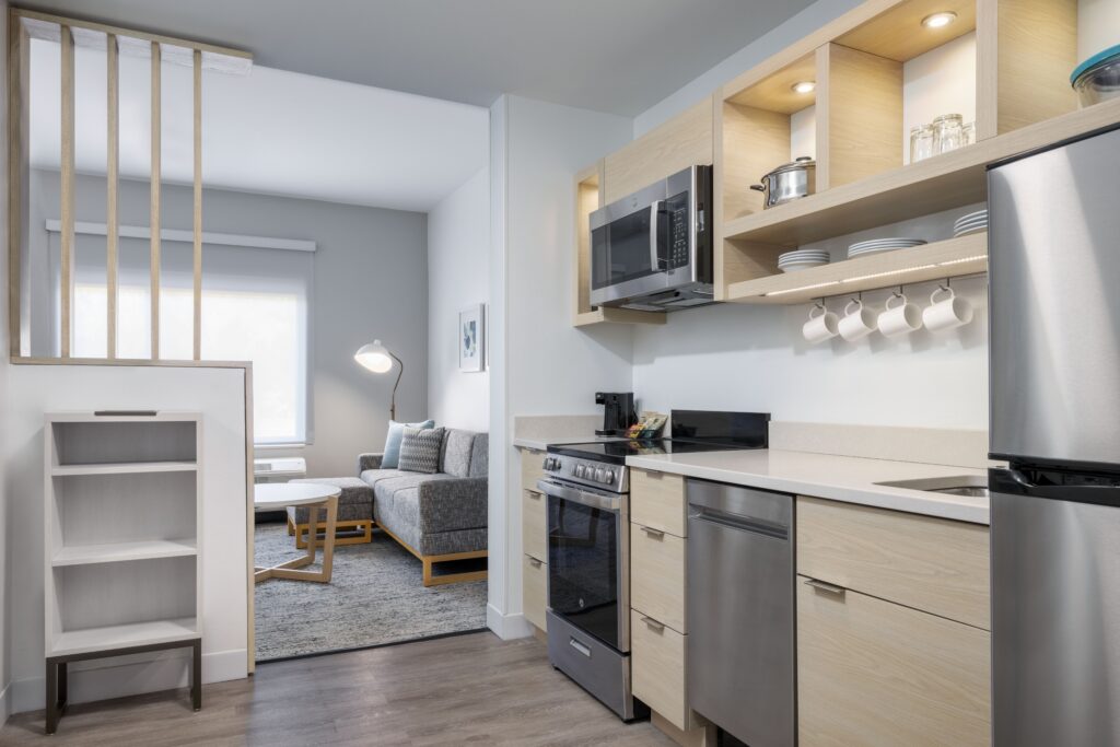 Full kitchen and living space within a TownePlace Brunswick suite.